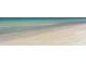 Beach with white sand and turquoise water at 5324 Siesta Ct, Sarasota, FL 34242