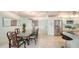 Open concept dining room area showcasing tile floors, updated appliances and ample space for entertaining at 5324 Siesta Ct, Sarasota, FL 34242