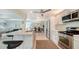 Modern kitchen with stainless steel appliances and an island with seating at 5324 Siesta Ct, Sarasota, FL 34242