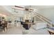 Bright, open living area with high ceilings, fireplace, and access to outdoor patio at 5324 Siesta Ct, Sarasota, FL 34242