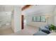 Inviting living area with large windows, wood beam ceiling, and access to an outdoor balcony at 5324 Siesta Ct, Sarasota, FL 34242
