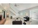 Cozy living room space featuring a fireplace, stairs to upper level, and tile flooring at 5324 Siesta Ct, Sarasota, FL 34242