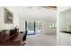 Spacious office area with sliding glass doors opening to the outdoor balcony at 5324 Siesta Ct, Sarasota, FL 34242