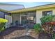 Charming townhouse backyard featuring a lanai and attractive landscaping at 5354 Myrtle Wood # 50, Sarasota, FL 34235