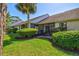 Townhouse backyard with well-maintained landscaping and screened in lanai at 5354 Myrtle Wood # 50, Sarasota, FL 34235