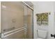Bathroom featuring glass shower and towel rack with two green decorative towels at 5354 Myrtle Wood # 50, Sarasota, FL 34235