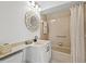 Neutral bathroom featuring a decorative mirror and combination tub and shower at 5354 Myrtle Wood # 50, Sarasota, FL 34235