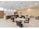A stunning dining area with tables and chairs, a long bar, and a lovely lounge area at 5354 Myrtle Wood # 50, Sarasota, FL 34235