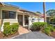 Charming villa featuring well-maintained landscaping and a welcoming front entrance at 5354 Myrtle Wood # 50, Sarasota, FL 34235