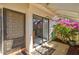 Welcoming front entry with a covered porch and decorative plants at 5354 Myrtle Wood # 50, Sarasota, FL 34235