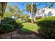 Nicely landscaped front yard of this townhouse with mature trees and shrubs at 5354 Myrtle Wood # 50, Sarasota, FL 34235