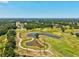 Scenic golf course with winding paths, serene ponds, and lush green landscape at 5354 Myrtle Wood # 50, Sarasota, FL 34235