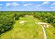 Scenic aerial view of golf course featuring well-maintained green and sand traps at 5354 Myrtle Wood # 50, Sarasota, FL 34235