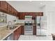 Well-equipped kitchen featuring stainless steel appliances and granite countertops at 5354 Myrtle Wood # 50, Sarasota, FL 34235