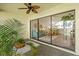 Enclosed lanai with ceiling fan, tile floors, and sliding glass doors to the living area at 5354 Myrtle Wood # 50, Sarasota, FL 34235