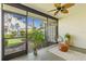 Screened lanai featuring plants and a chair to enjoy the outdoor landscape at 5354 Myrtle Wood # 50, Sarasota, FL 34235