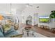 Spacious living room boasting wood floors, a vaulted ceiling, and an open floor plan at 5354 Myrtle Wood # 50, Sarasota, FL 34235