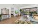Cozy living room showcasing wood floors, vaulted ceiling, and view to the bedroom at 5354 Myrtle Wood # 50, Sarasota, FL 34235