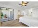 Spacious main bedroom with hardwood floors, natural light, and access to a sunroom at 5354 Myrtle Wood # 50, Sarasota, FL 34235