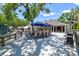 Outdoor dining area with umbrella-shaded tables perfect for al fresco meals and relaxation at 5354 Myrtle Wood # 50, Sarasota, FL 34235