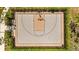 Aerial view of community basketball court with surrounding greenery and benches at 5554 Blue Azure Dr, Wimauma, FL 33598