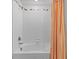 Charming bathroom features a tub with white tile surround and a shower head at 5554 Blue Azure Dr, Wimauma, FL 33598