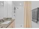 Updated bathroom featuring a granite countertop, new vanity, and a shower with white subway tile at 5554 Blue Azure Dr, Wimauma, FL 33598