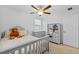 Comfortable bedroom with carpet flooring and a ceiling fan, a dresser, and light gray furniture at 5554 Blue Azure Dr, Wimauma, FL 33598