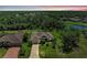 Sprawling property backing to lush greenery with a long driveway and meticulously maintained lawn at 5616 90Th Avenue E Cir, Parrish, FL 34219