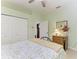 The spacious bedroom has a neutral color scheme, closet, and furniture at 5616 90Th Avenue E Cir, Parrish, FL 34219
