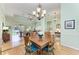 Dining room open to the living area with hardwood floors and natural light at 5616 90Th Avenue E Cir, Parrish, FL 34219