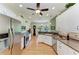 Spacious kitchen with stainless steel appliances, white cabinetry, and hardwood floors at 5616 90Th Avenue E Cir, Parrish, FL 34219