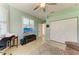 Bright living room featuring neutral decor, plantation shutters, a large tv, and double door closet at 5616 90Th Avenue E Cir, Parrish, FL 34219