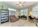 Home office featuring a neutral color scheme, large windows, comfortable seating, and workspace at 5616 90Th Avenue E Cir, Parrish, FL 34219