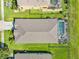 Aerial view of a single-Gathering home features a screened-in pool and lush backyard at 5919 100Th E Ave, Parrish, FL 34219