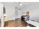 Bright bedroom with wood floors has closet and large desk and storage at 5919 100Th E Ave, Parrish, FL 34219
