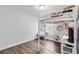 Small bedroom features a bunkbed, wood floors, and small writing desk at 5919 100Th E Ave, Parrish, FL 34219