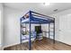 Bedroom featuring a loft bed with a built-in desk, chair, and shelving at 5919 100Th E Ave, Parrish, FL 34219