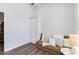 Comfortable room with wood floors features window and a comfortable brown futon at 5919 100Th E Ave, Parrish, FL 34219