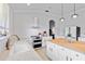 Bright kitchen featuring white cabinets, marble countertops, stainless steel appliances, and a butcher block island at 5919 100Th E Ave, Parrish, FL 34219