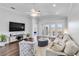 Spacious living room with hardwood floors, lots of light, and comfortable seating at 5919 100Th E Ave, Parrish, FL 34219
