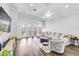 Cozy living room featuring hardwood floors, french doors, stylish furniture, and modern decor at 5919 100Th E Ave, Parrish, FL 34219