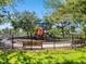 Playground with colorful equipment and shaded benches in a community park at 5919 100Th E Ave, Parrish, FL 34219