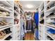 Organized walk-in closet with custom shelving, drawers, and ample storage space for clothes and shoes at 5919 100Th E Ave, Parrish, FL 34219