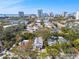 Stunning aerial view of the neighborhood, showcasing lush greenery and city skyline, blue skies, and residential homes at 652 Ohio Pl, Sarasota, FL 34236