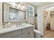 Bright bathroom featuring a large mirror, modern vanity, and convenient closet space at 652 Ohio Pl, Sarasota, FL 34236