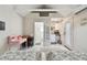 Studio-style bedroom featuring two beds, a kitchenette, and a connected bathroom with a shower at 652 Ohio Pl, Sarasota, FL 34236