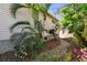 Home exterior with palm trees and brick pathway at 652 Ohio Pl, Sarasota, FL 34236