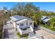 Charming single Gathering home showcasing well-manicured landscaping and a metal roof at 652 Ohio Pl, Sarasota, FL 34236