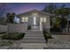 Inviting front exterior view featuring a symmetrical facade, gray stairs, and a welcoming entrance at 652 Ohio Pl, Sarasota, FL 34236